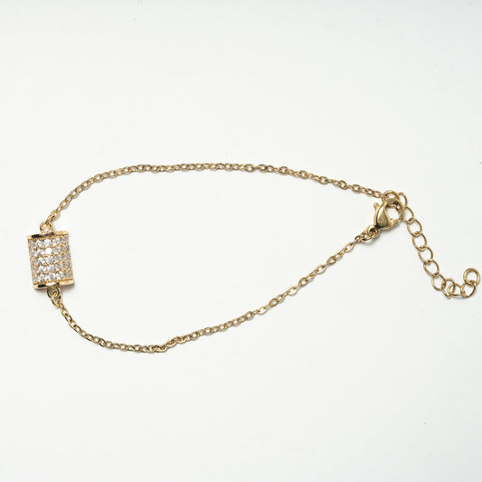 Gold bracelet with a decorative clasp on a white background. Harma 14k gold plated Golden Barrel Chain Bracelet