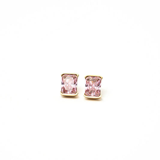 Pair of pink gemstone earrings with gold settings on a white background. Harma jewelry gold plated I Am Centered PINK Zirconia Stud Earrings