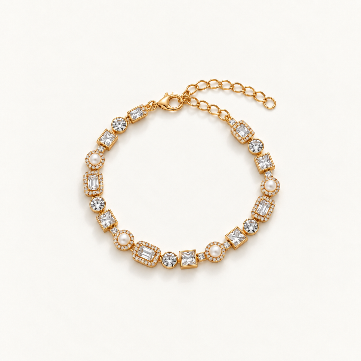 A gold-plated tennis bracelet featuring clear baguette and round-cut crystals, accented with small white pearls, displayed on a clean off-white background. Autumn Constellation Zirconia Bracelet | Harma Jewelry 18k gold plated