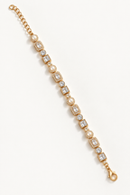 A gold tennis bracelet featuring alternating round pearl and rectangular clear gemstone links, displayed diagonally on a clean white background. Autumn Constellation Zirconia Bracelet | Harma Jewelry 18k gold plated