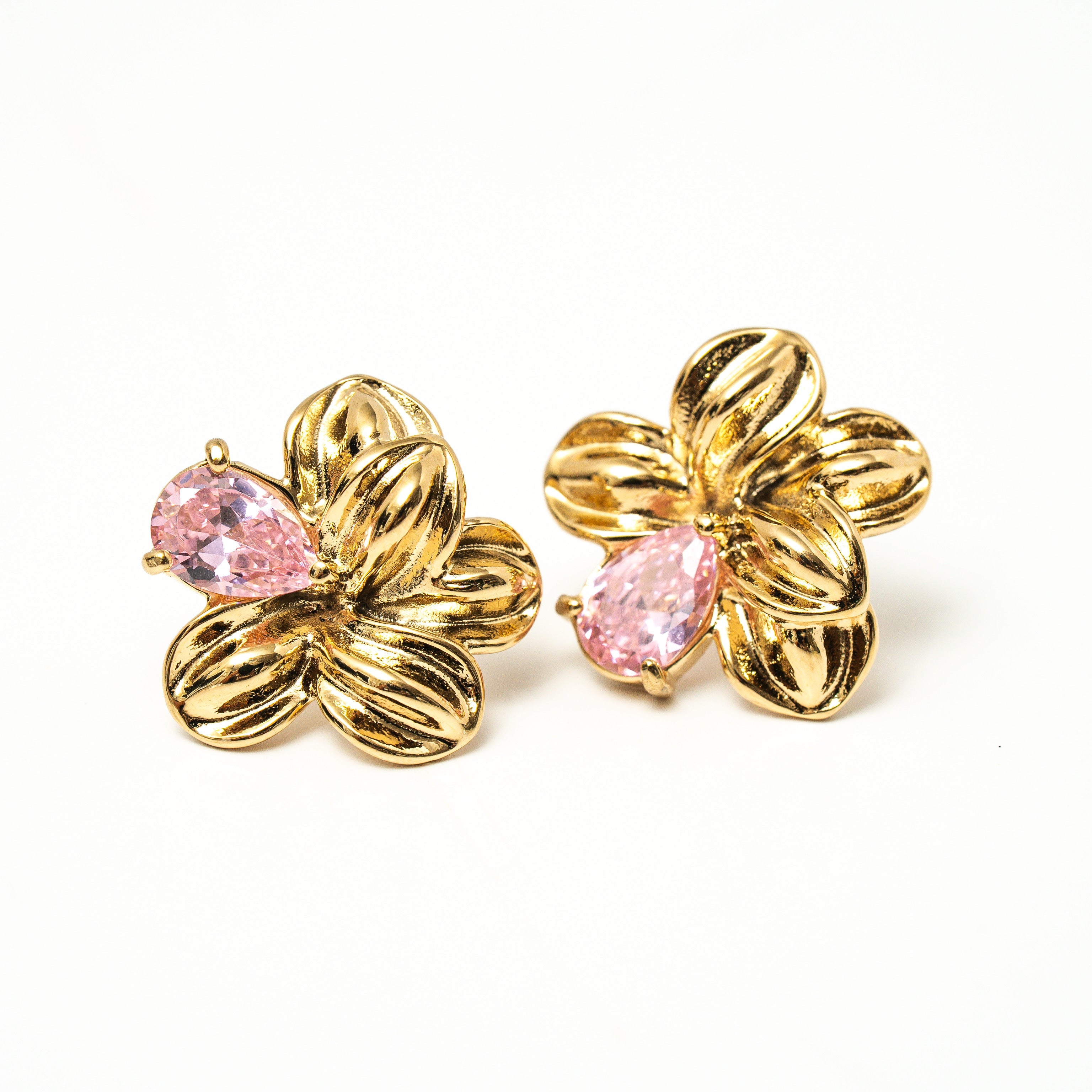Gold earrings with pink gemstones on a white background. Harma gold plated Bloom Again Gold Earrings