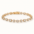A yellow gold tennis bracelet adorned with round and marquise-cut diamonds, arranged in a circular shape on a clean white background. Fall Constellation Zirconia Bracelet 18k gold plated Harma jewlery