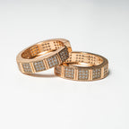 Two rose gold rings with diamond accents on a light gray background Harma Horizon Edge Zirconia Hoop Earrings