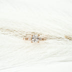 Gold ring with a Zirconia stone princess cut on a white background