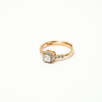 Gold ring with a diamond on a white background 