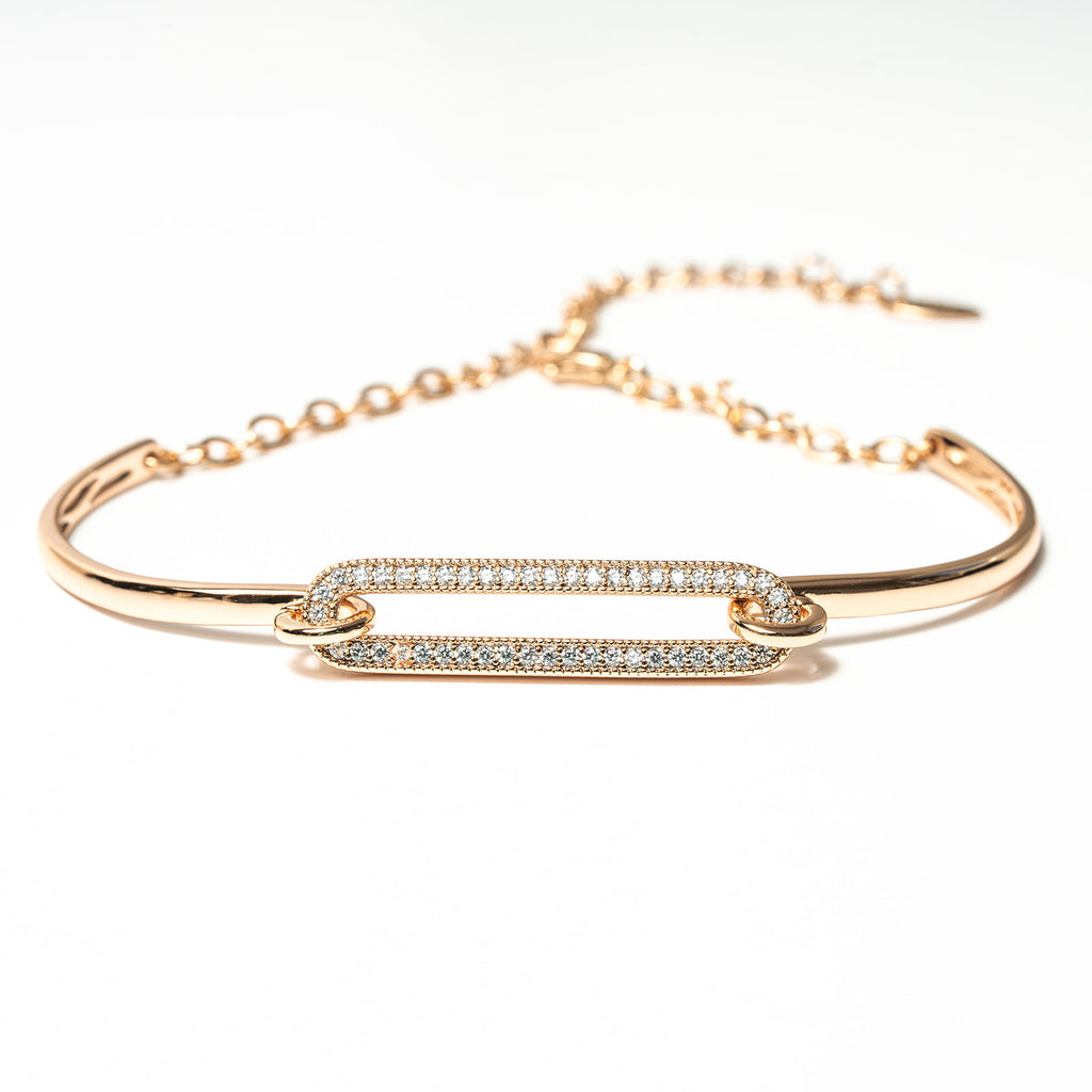 Gold bracelet with diamond accents on a white background. Harma Jewelry Cubic Zirconia Incrusted Sumptuous Paper Clip Bangle Chain