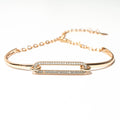 Gold bracelet with diamond accents on a white background. Harma Jewelry Cubic Zirconia Incrusted Sumptuous Paper Clip Bangle Chain