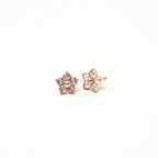 Pair of star-shaped earrings with pink gemstones on a white background. Harma Jewelry Gold Plated Little Bloom PINK Zirconia Earrings