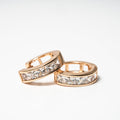 Rose gold hoop earrings with clear gemstones on a light background Harma Jewelry Medium Hoops Cubic Zirconia Lined Backing