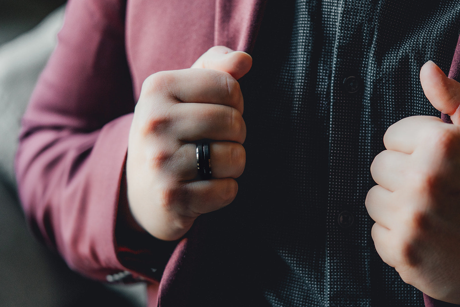 Close-up of a person wearing a ring on their finger with a blurred background Harma Jewelry Men Tungsten Carbide Band Ring Black Barrel Simple 