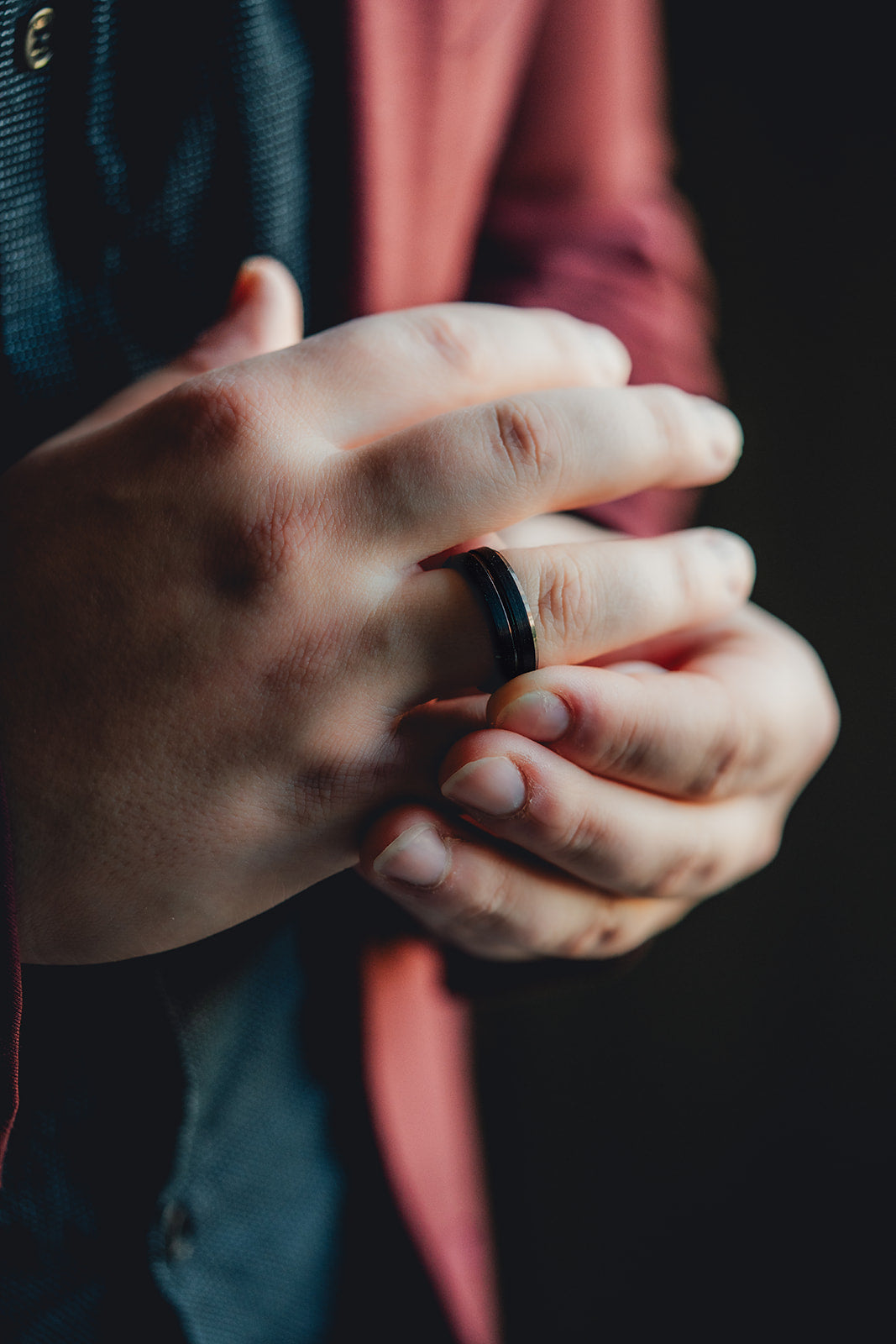 Close-up of a person's hand wearing a black ring on a dark background Harma Jewelry Men Tungsten Carbide Band Ring Black Barrel Simple 