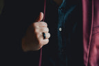 Person wearing a dark shirt with a red garment partially visible, holding a black object. Harma Jewelry Men Tungsten Carbide Band Ring Black Simple 