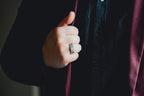 Hand wearing a ring on a dark background  Harma Jewelry Men Tungsten Carbide Band Ring Silver Hammered