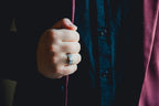 Hand wearing a ring holding a red string, with a dark background Harma Jewelry Men Tungsten Carbide Band Ring Silver Simple 