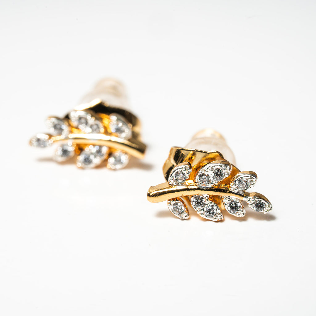 Gold and pearl leaf-shaped earrings on a white background. Harma Jewelry Olive Branch Of Hope Stud Earrings Full Cubic Zirconia Gold Plated