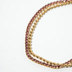 Two beaded bracelets with pink and gold beads on a white background. Harma Jewelry gold plated Dual Radiance PINK Tennis Bracelet