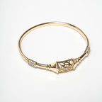 Gold bracelet with intricate design on a white background Harma Luminous Noor Lantern Bracelet