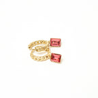 Gold ring with red gemstones on a white background. Harma Gold plated Rosy Revival Link Chain Crystal Hoop Earrings