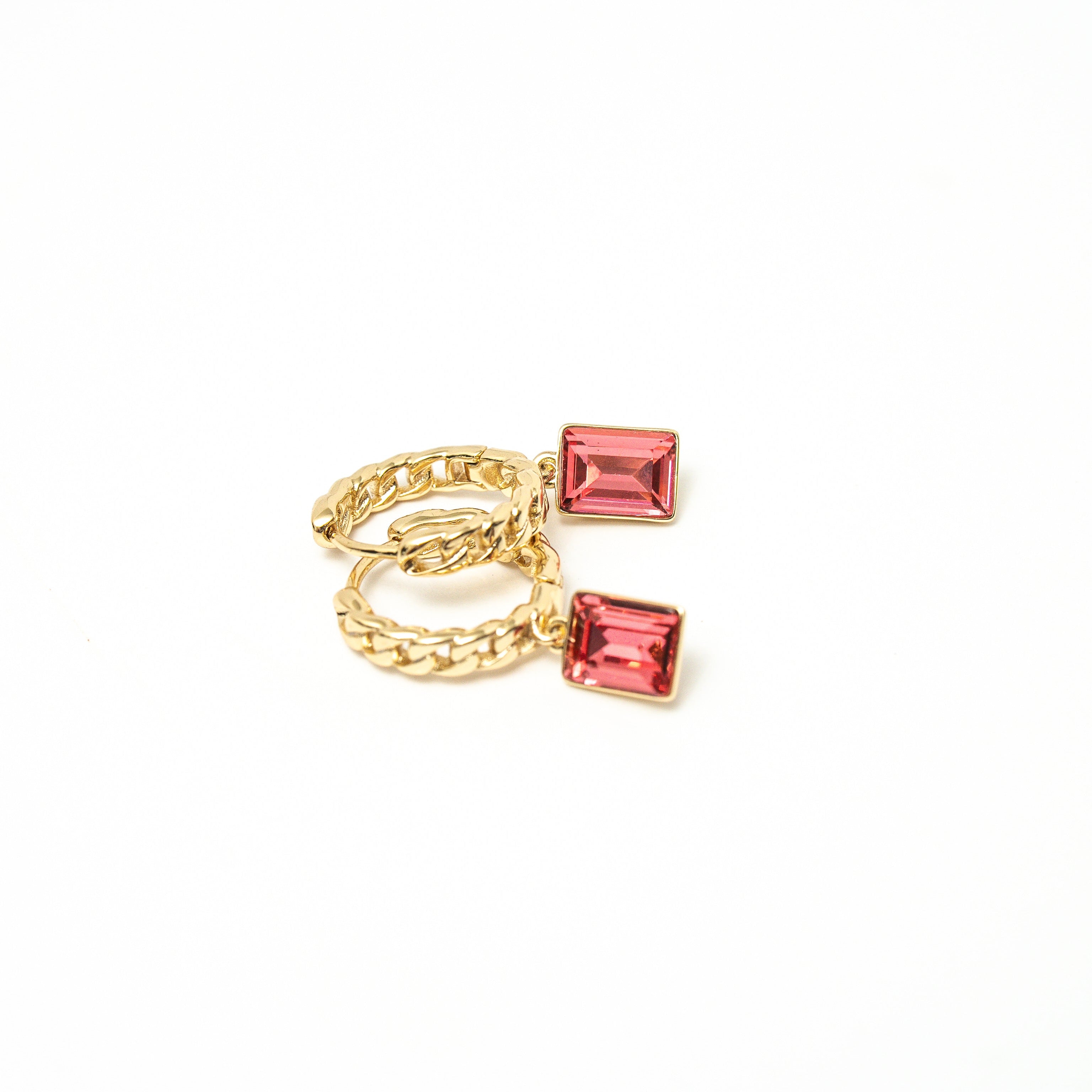 Gold ring with red gemstones on a white background. Harma Gold plated Rosy Revival Link Chain Crystal Hoop Earrings