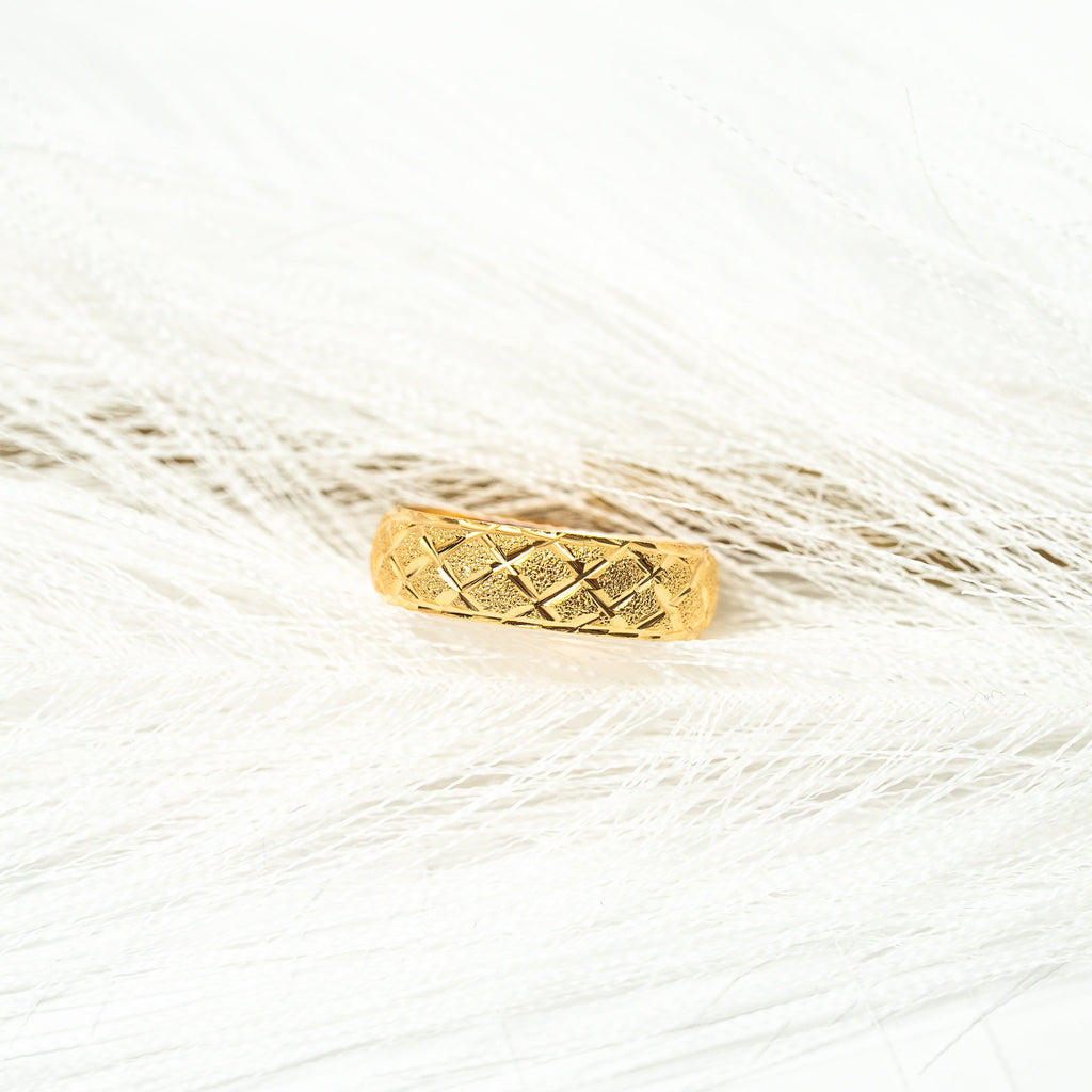 Gold ring with a textured band on a white background. Harma_Jewelry_Timeless_Bands_24K_Gold-Plated_Adjustable_Rings_2