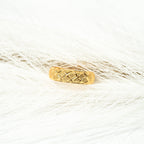 Gold ring with a textured band on a white background. Harma_Jewelry_Timeless_Bands_24K_Gold-Plated_Adjustable_Rings_2