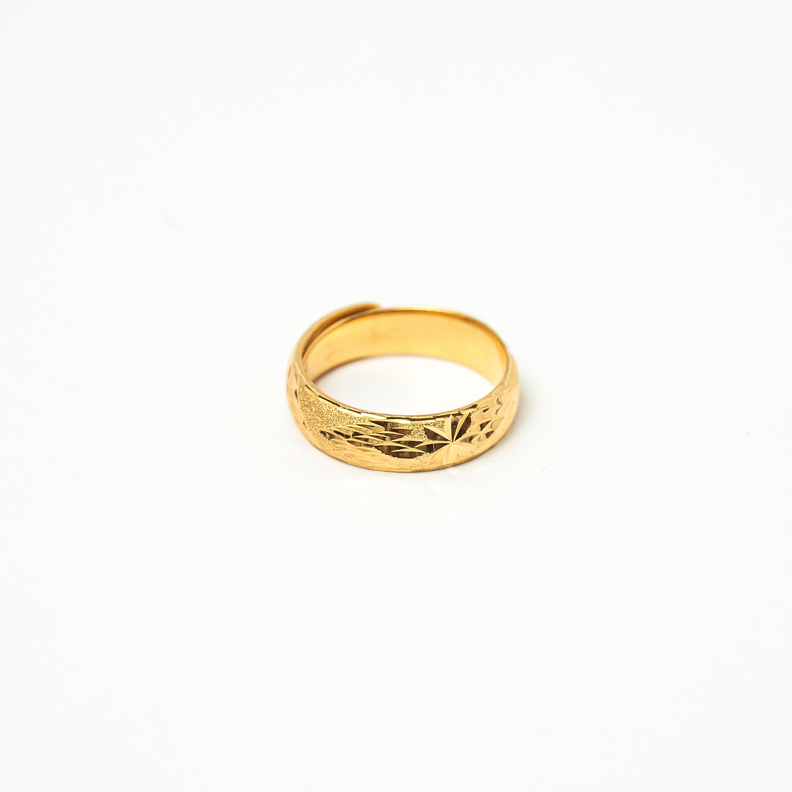 Gold ring on a white background. Harma Jewelry Timeless_Bands_24K_Gold-Plated_Adjustable_Rings