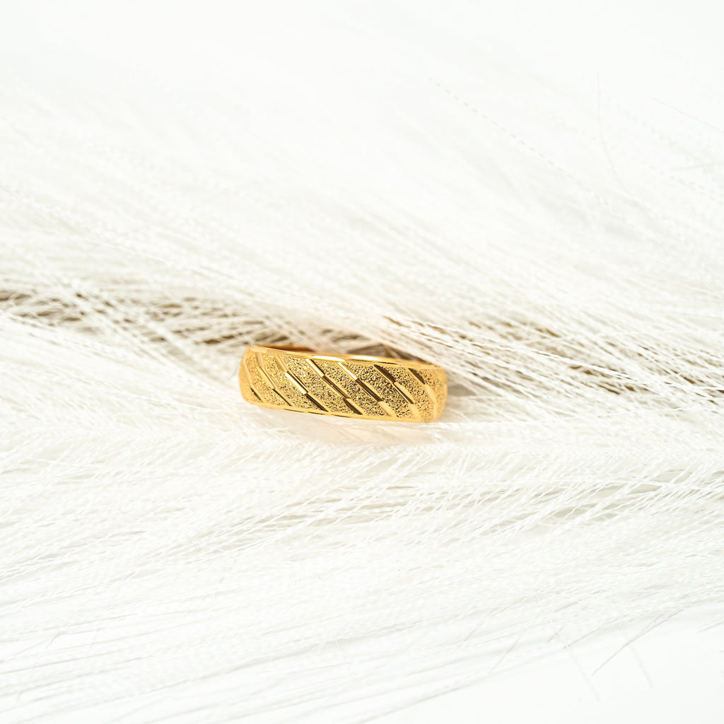 Gold ring on a white background. Harma_Jewelry_Timeless_Bands_24K_Gold-Plated_Adjustable_Rings_2