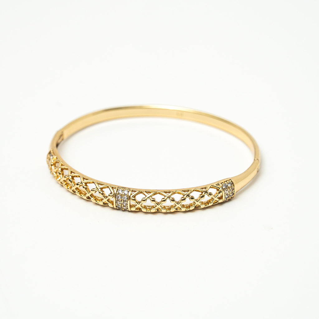 Gold bracelet with intricate design on a white background. Harma jewelry gold plated Golden Heritage Bangle Bracelet