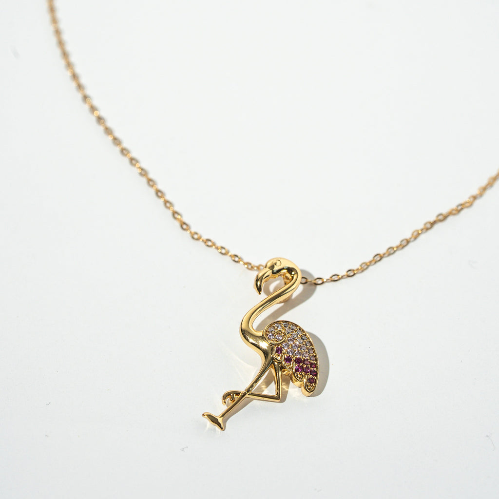 Gold necklace with a flamingo pendant on a white background Harma jewelry s925 I Am Becoming PINK Again Flamingo Necklace 1