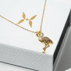 Gold flamingo pendant necklace on a white card Harma jewelry s925 I Am Becoming PINK Again Flamingo Necklace 1