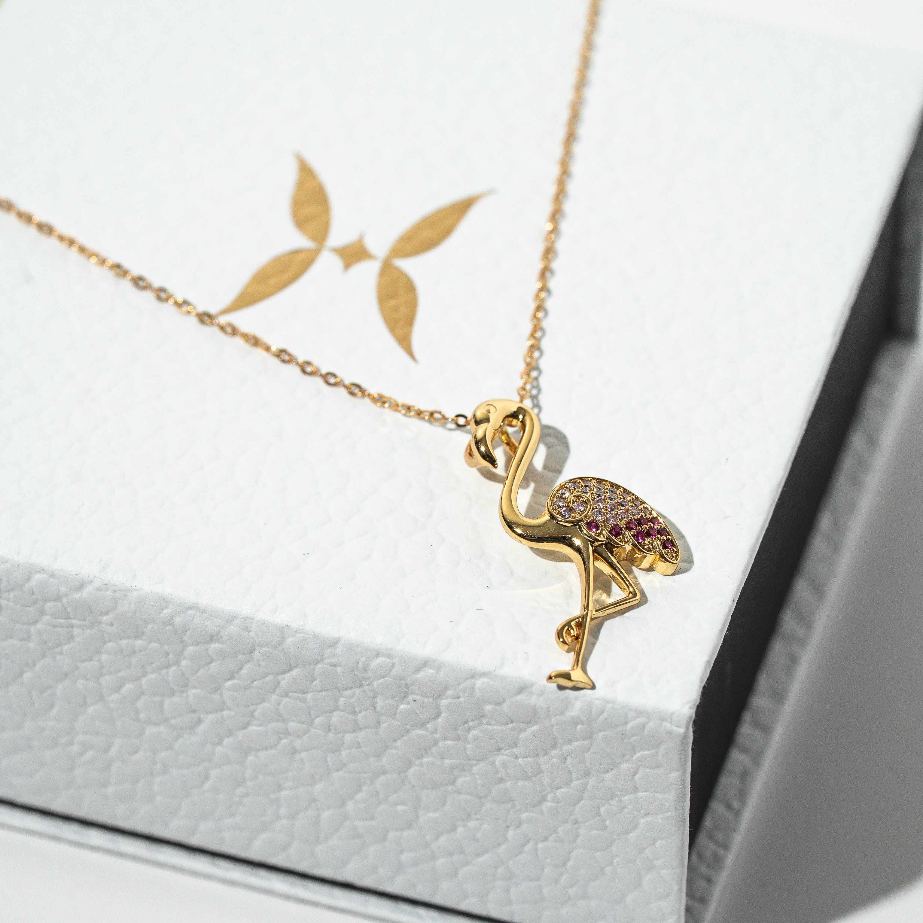 Gold flamingo pendant necklace on a white card Harma jewelry s925 I Am Becoming PINK Again Flamingo Necklace 1