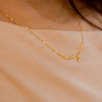 Gold necklace with a small heart pendant on a person's neck against a neutral background Harma jewelry s925 I Am Guided Sparkle Sterling Silver Zirconia Necklace