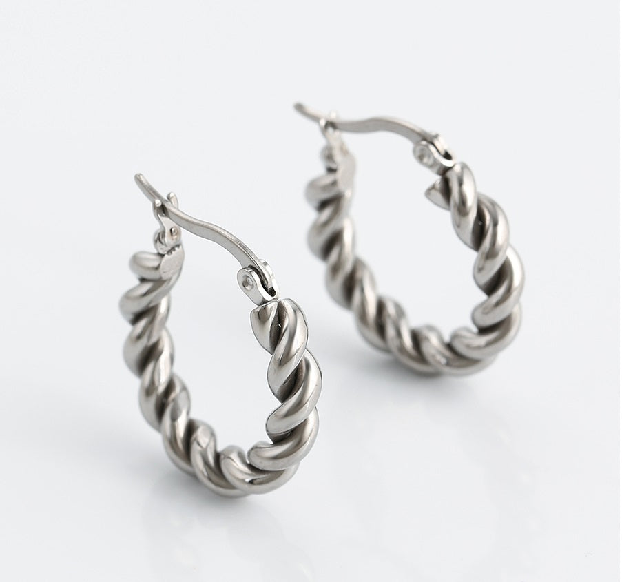 Pair of silver hoop earrings on a white background harma-jewelry-divine-Fearless-24k gold Plated Platinum Plated-Twisted-Bold Earrings