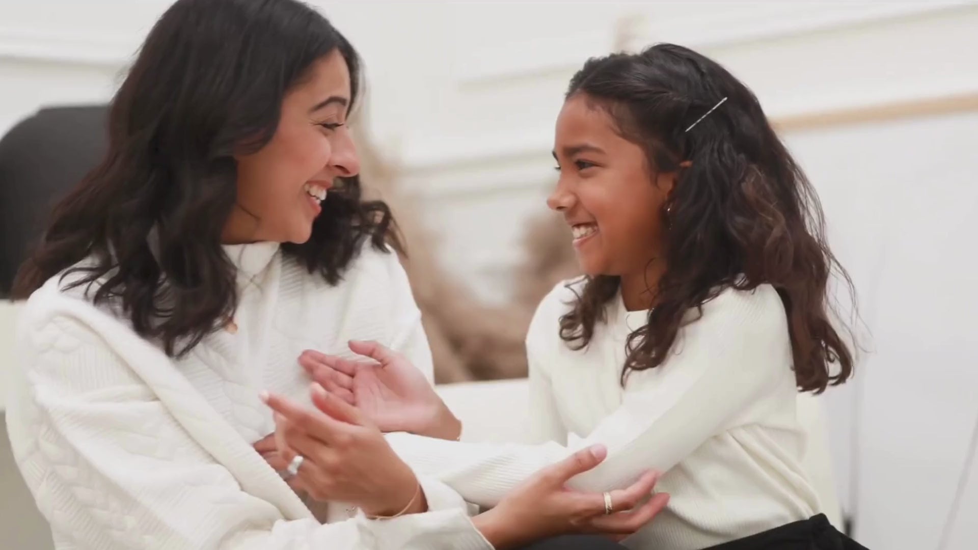 Load video: mother and daughter wearing HARMA jewelry laughing